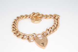 A 9ct yellow gold chased hollow link bracelet and padlock 17.3 grams