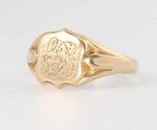 A gentleman's 18ct yellow gold shield shaped ring, 6.5 grams, size S 1/2