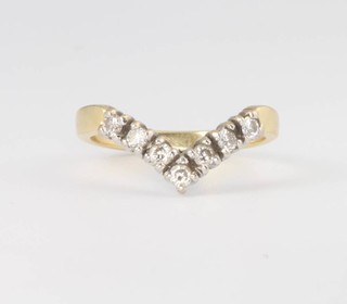An 18ct yellow gold diamond set wishbone ring, approx. 0.5ct, size N 1/2, 3.7 grams