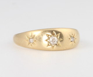 An 18ct yellow gold diamond set gypsy ring, 2.7 grams, size M 