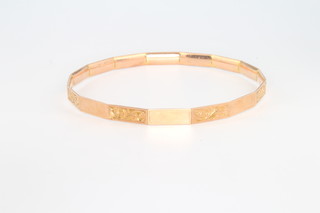 A 9ct yellow gold chased bangle 19.2 grams 