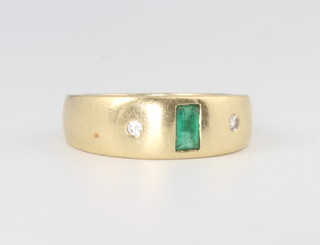 An 18ct yellow gold baguette cut emerald and brilliant cut diamond ring 8.6 grams, size O 1/2