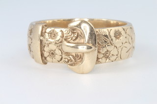 A 9ct yellow gold buckle ring with chased floral decoration, 11 grams 