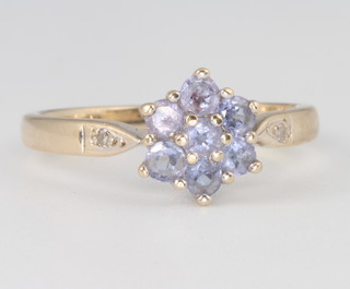 A 9ct yellow gold tanzanite cluster ring, size P, 2.8 grams