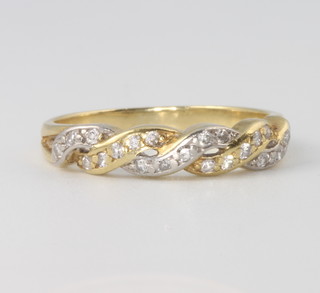 An 18ct yellow gold diamond crossover ring, 3 grams, size O 