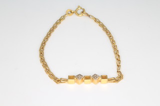 An 18ct yellow gold diamond set bracelet 3.4 grams, 15cm 
