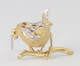 An 18ct 2 colour gold ruby and diamond bird brooch 6.1 grams, 30mm