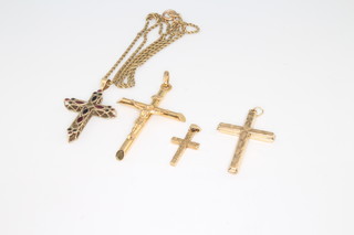 Four 9ct yellow gold crosses, 1 with chain 9.6 grams 