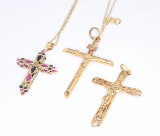 Three 9ct yellow gold crosses and a ditto chain 6.4 grams