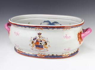 An 18th Century style Chinese foot bath decorated with a faux armorial, the interior with carp 58cm 
