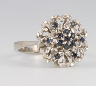 An 18ct white gold sapphire cluster ring 3.7 grams, size M 