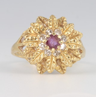 An 18ct yellow gold ruby and diamond leaf pattern ring size N 1/2, 5.1 grams