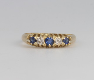 An 18ct yellow gold sapphire and diamond ring 2.6 grams, size K 