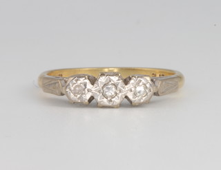 An 18ct yellow gold 3 stone diamond ring size P, 3.6 grams