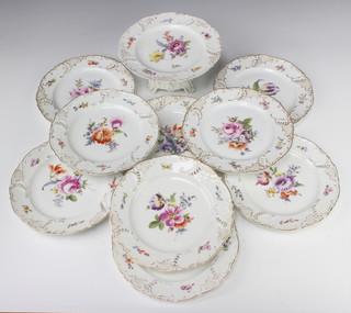 An early 20th Century Continental pierced porcelain dessert service with gilt and floral decoration comprising 9 plates and 1 tazza
