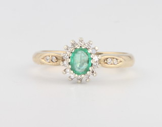 A 9ct yellow gold emerald and diamond oval cluster ring size N 2.8 grams 