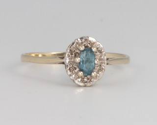 A 9ct yellow gold aquamarine and diamond oval cluster ring 1.9 grams, size S