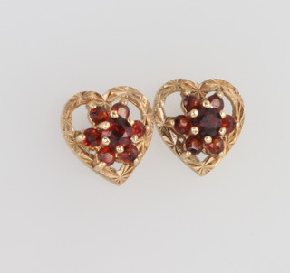 A pair of 9ct yellow gold garnet set heart shaped ear studs 1.9 grams, 10mm
