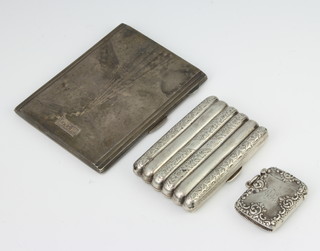 An Edwardian silver torpedo shape cigarette case, an engine turned ditto and a vesta, 272 grams 