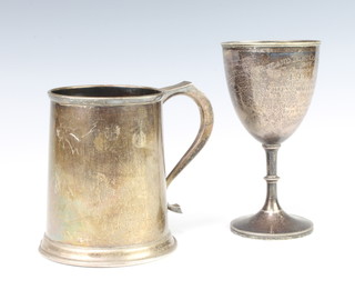 A silver mug of plain form and angular handle, Birmingham 1970, together with a silver trophy cup 455 grams