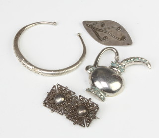 A Continental silver brooch, 2 others and a bangle 61 grams