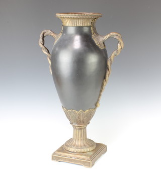 A Continental porcelain oviform vase with gilt metal mounts and rope twist handles 53cm 