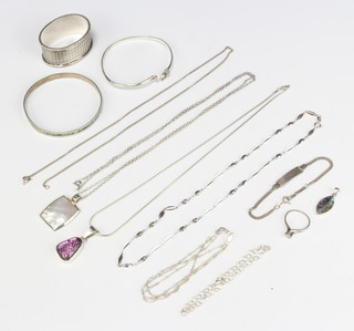 A silver bangle and minor silver jewellery, 100 grams 