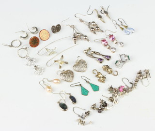 A quantity of silver earrings
