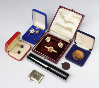 A commemorative medallion and minor enamelled cufflinks etc