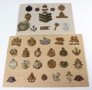 A quantity of Second World War and later army cap badges