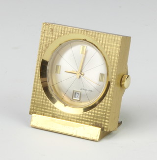 A 1970's gilt cased Jaguar bedside timepiece with calendar dial 4.5cm 