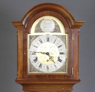 A 1930's 8 day chiming longcase clock with 19cm arched gilt dial and silver chapter ring, contained in a walnut case with sliding hood 169cm h 