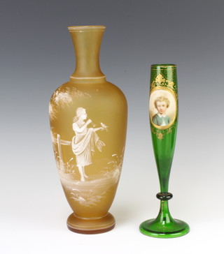 A Victorian Bohemian green glass tapered vase decorated with a portrait of a child 25cm together with a Mary Gregory style amber baluster vase decorated with a young girl 30cm 