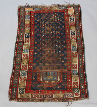 A North West Persian blue and red ground prayer rug with central medallion within a multi ground border 150cm x 93cm 