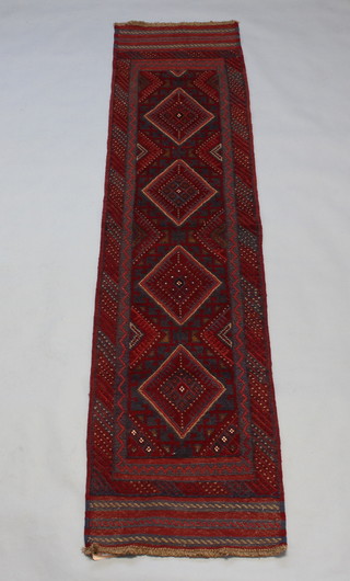 A Meshwani blue and red ground runner with 4 octagons to the centre within a multi row border 246cm x 60cm 