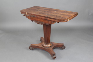 A William IV D shaped rosewood tea table raised on a chamfered column with triform base and scrolled feet 75cm x 91cm x 46cm 