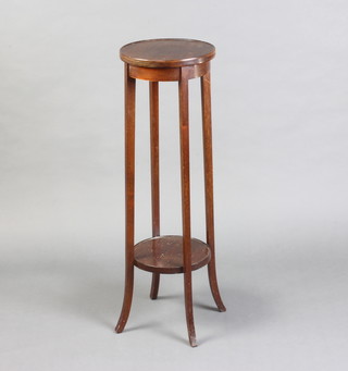 An Edwardian circular mahogany 2 tier jardiniere stand 95cm h x 30cm diam. (some scratches to the top) 
