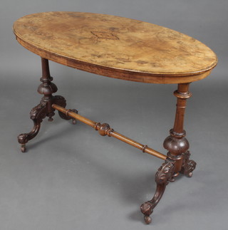 A Victorian figured walnut and quarter veneered oval table raised on turned supports with H framed stretcher 71cm h x 108cm w x 64cm d  