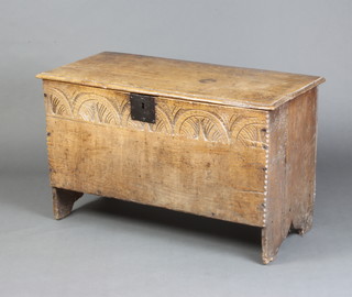 A 17th/8th Century oak coffer of panelled construction with hinged lid and candle box to the interior 54cm h x 91cm w x 39cm d