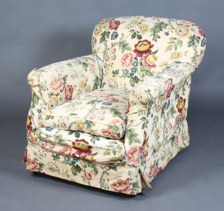 A Howard style armchair upholstered in white material, raised on square supports and with floral loose cover 81cm h x 90cm w x 80cm d 