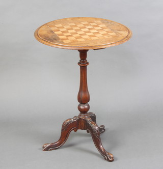 A Victorian inlaid walnut circular chess table, raised on a carved pillar and tripod base 68cm h x 53cm diam.  