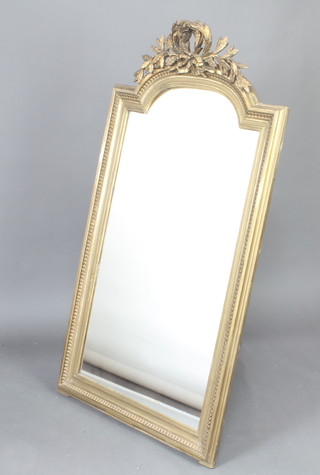A plate wall mirror contained in a 19th Century gilt arched frame with floral leaf decoration 53cm x 85cm 