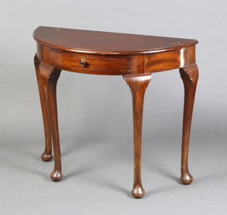 A 1920's Georgian style mahogany demi-lune hall table fitted a drawer, raised on club supports 78cm h x 92cm w x 40cm d 