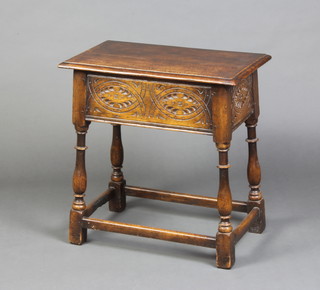 A 17th Century style carved oak stool with hinged boxed seat lid and carved apron, raised on turned and block supports with box framed stretcher 61cm h x 61cm w x 36cm d 