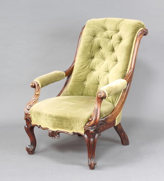 An early Victorian mahogany show frame open arm chair upholstered in green dralon, raised on cabriole supports
