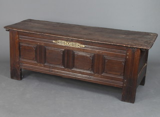 An 18th Century carved oak coffer of panelled construction with 3 plank lid, 68cm h x 175cm w x 61cm d 