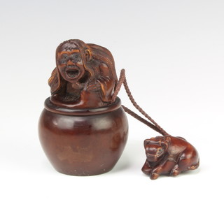 A modern Chinese carved hardwood box and cover, the finial decorated with a figure together with a carved hardwood inro of an animal 7cm 