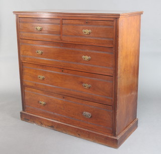 An Edwardian Art Nouveau walnut chest of 2 short and 3 long drawers with brass swan neck drop handles, raised on a platform base 121cm h x 122cm w x 53cm d 