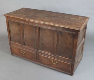 An 18th Century oak mule chest of panelled construction, the interior fitted a candle box (lid missing), the base fitted 2 drawers with brass swan neck drop handles 86cm h x 137cm  x 57cm d 