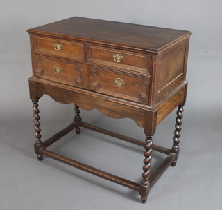An 18th Century oak chest of 2 short and 1 long drawer with geometric mouldings, raised on a later stand with shaped apron and spiral turned supports 105cm h x 97cm w x 55cm d 